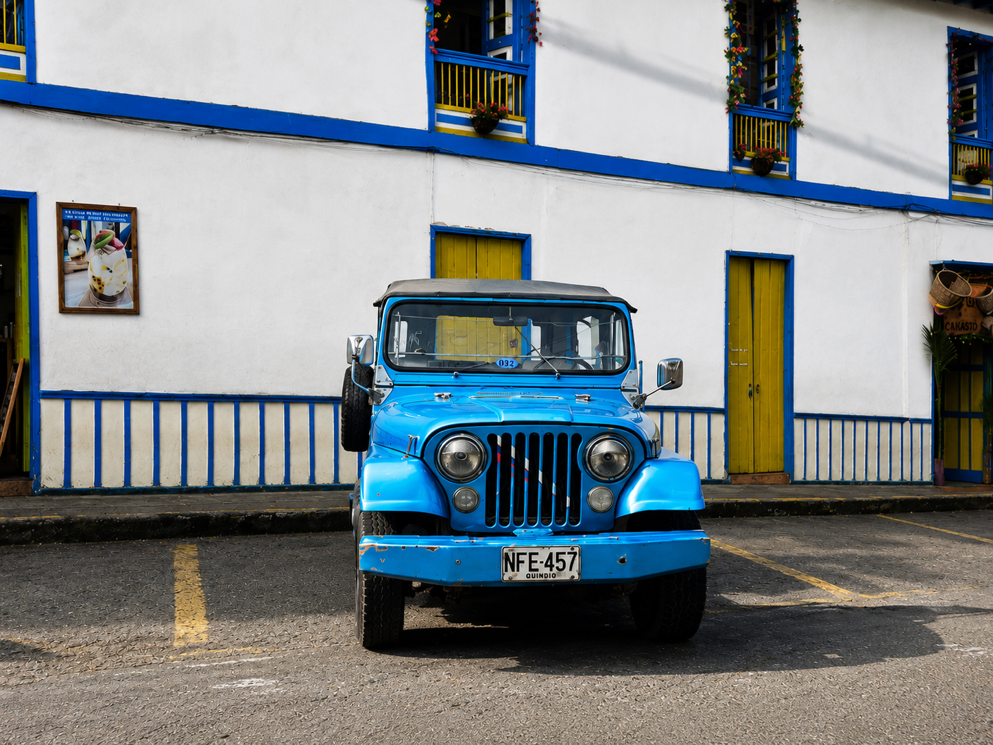 Blue and yellow Willys Jeeps in Filandia Colombia